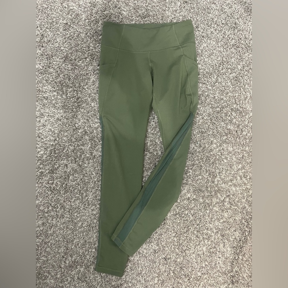 Olive green athletic leggings with mesh detailing